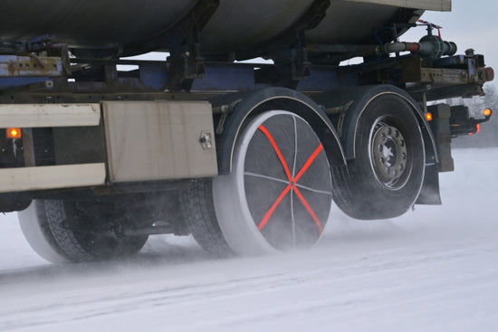 Snow socks for trucks mounted on rear wheels and driven on snow and ice