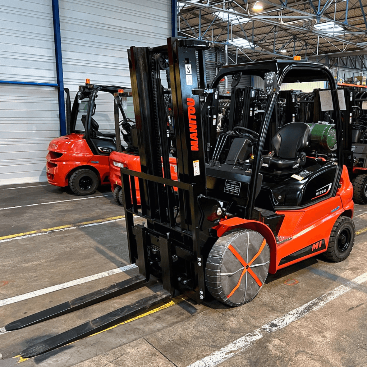 AutoSock AF traction device mounted on front wheels of a forklift