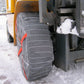 AutoSock AF tire sock mounted on front wheel of a forklift standing on snow